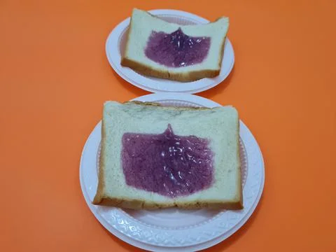 Bread with blueberry jam Stock Photos