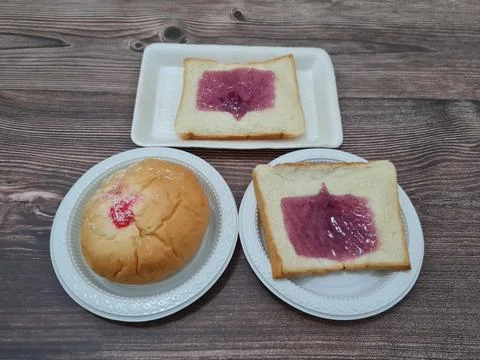 Bread with blueberry jam Stock Photos