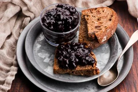 Bread with blueberry jam on the plate Stock Photos