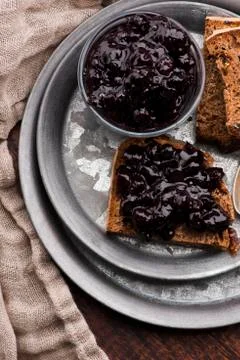Bread with blueberry jam on the plate Stock Photos