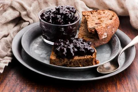 Bread with blueberry jam on the plate Stock Photos
