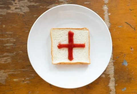 Bread of breakfast is written Plus sign by ketchup on write plate. A to Z and Stock Photos
