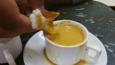 Bread-Bun-dipped-in-chai-India Video stock 86004356