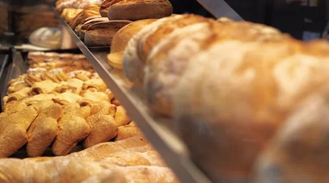 Bread, buns and other bakery products of golden color on store shelves Stock Footage 64735118