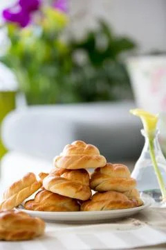 Bread buns in a plate on a table Stock Photos