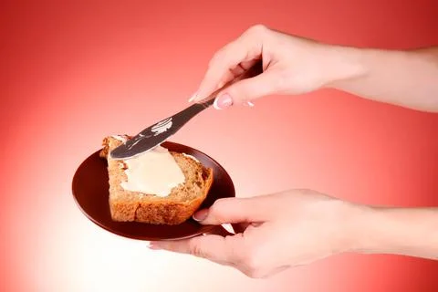 Bread with butter. Simple breakfast concept. Stock Photos