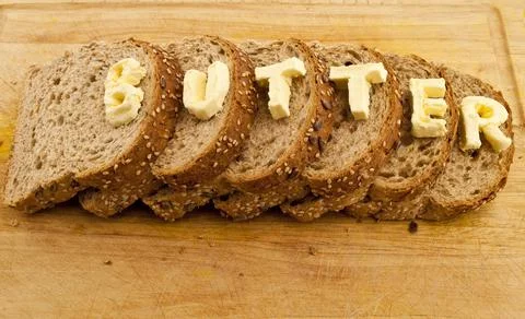 Bread with butter. Simple breakfast concept. Stock Photos