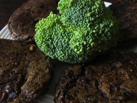 Bread cakes with broccoli on a plate Stock Photos