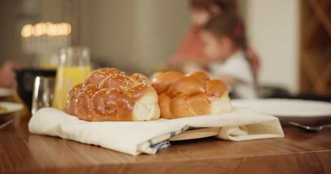 Bread, challah and food on table for shabbat, party or celebration with family Stock Footage 256286992
