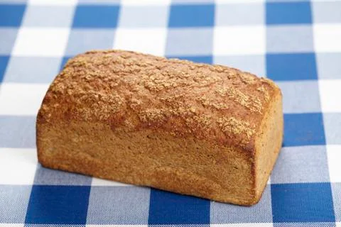 Bread on a checkered tablecloth Stock Photos