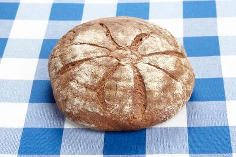 Bread on a checkered tablecloth Stock Photos