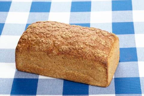 Bread on a checkered tablecloth Stock Photos