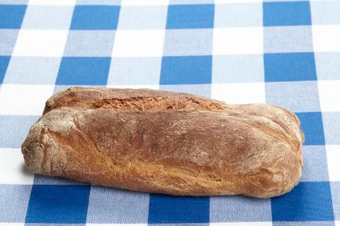 Bread on a checkered tablecloth Stock Photos