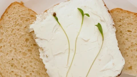Bread with cheese and microgreens. Healthy eating concept. Stock-Footage 136980487