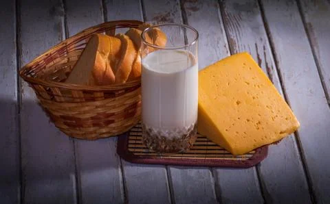 Bread, cheese and milk on the table Stock Photos