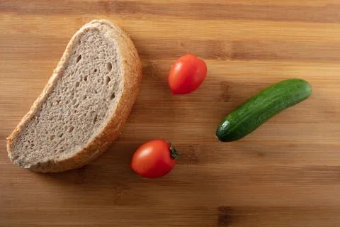 Bread with cherry tomatoes  and cucumber Stock Photos