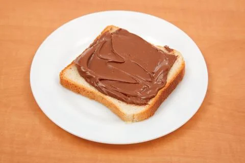 Bread with chocolate cream Stock Photos