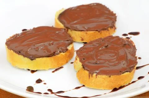 Bread with chocolate cream Stock Photos