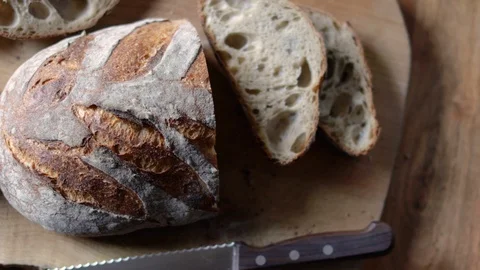 Bread, Cloth, and Knife On A Cutting Board Video stock 128675777