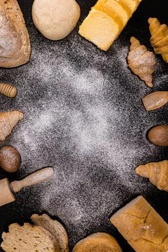 Bread concept slices of bread, buns, croissants, and loaves of bread arranged Stock Photos