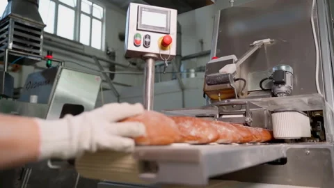 Bread on a conveyor belt. Slow motion Stock Footage 250274426