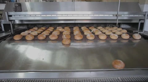The bread on the conveyor oven. Bread bakery food factory Stock Footage 58586347