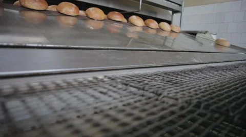 The bread on the conveyor oven. Bread bakery food factory Stock Footage 58586365