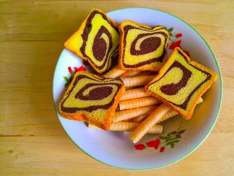 Bread cookies and also rolled cookies in a bowl on the table Stock Photos