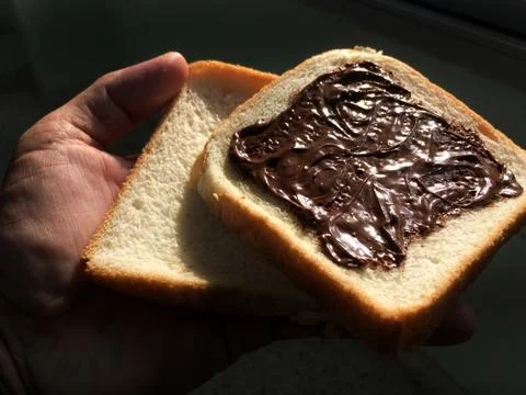 Bread covered with nutella, can be eaten at every meal Stock Photos