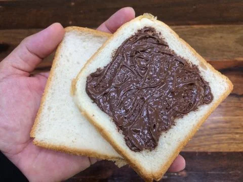 Bread covered with nutella, can be eaten at every meal Stock Photos