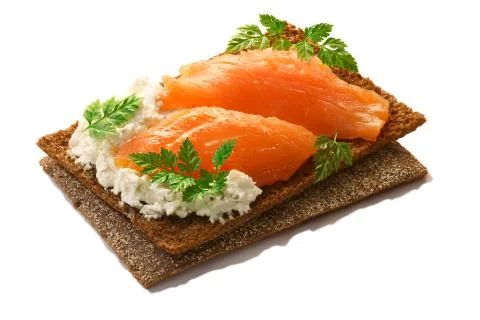 Bread crisp with salmon, soft cheese and chervil Stock Photos
