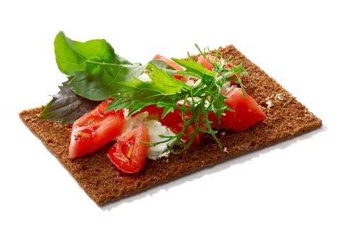 Bread crisp with tomato, soft cheese and greens Stock Photos