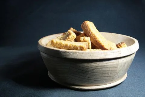 Bread croutons on a dark background Stock Photos