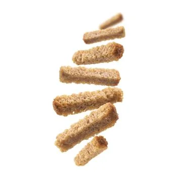 Bread croutons levitate on a white background Foto stock