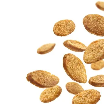 Bread croutons levitate on a white background Stock Photos