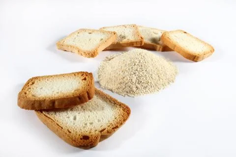 Bread crumbs with biscuits on white Stock Photos