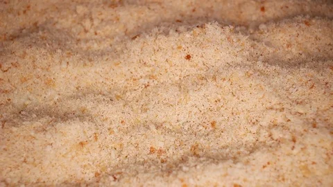Bread crumbs closeup texture video on rolling rotating looping plate Stock Footage 104332262