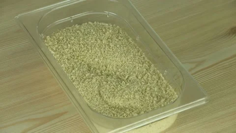 Bread crumbs in a container rotate Stock Footage 183080252