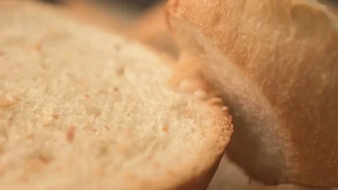 Bread crumbs falling on slices of white bread in slow motion on spinning plat Vídeos de archivo 164760089