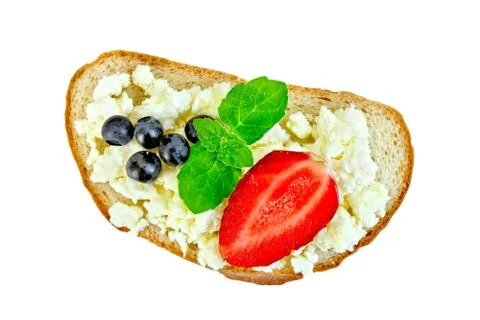 Bread with curd and berries in plate Stock Photos