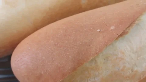 Bread cut with a knife at dinner Stock Footage 70688615