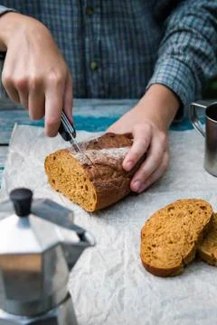 Bread cut on rustic table Stock Photos