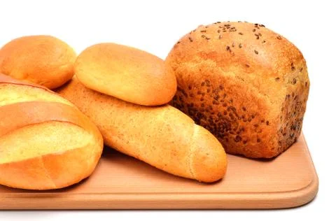 Bread on cutting board isolated on white Stock Photos