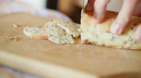 Bread cutting with sharp knife - closeup Stock Footage 35976555