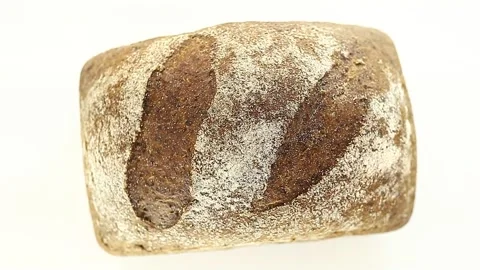 Bread dark whole, with flour, rotates, turning, top view Stock Footage 148495115