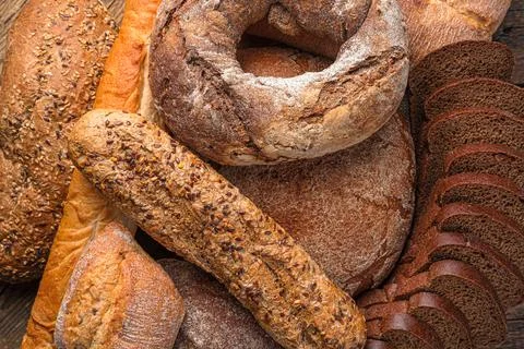 Bread of different types in close-up. Bread background. Stock Photos