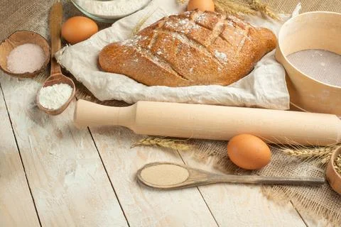 Bread of different varieties on a wood background with copy space background. Stock Photos