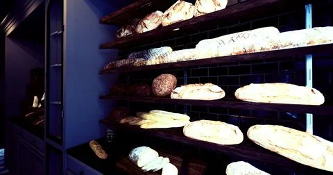 Bread on display in a bakery shop with various types and textures Illustrazione stock