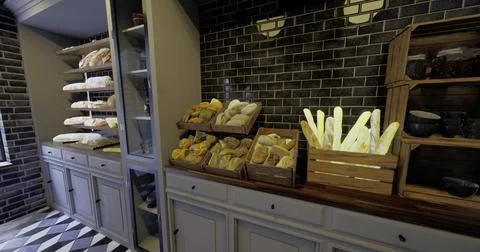 Bread display in a cozy bakery showcasing various baked goods and decor Stockillustratie