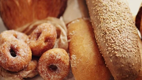 Bread displayed by the baker, assortment of Spanish baguette and traditional Stock Footage 232412949